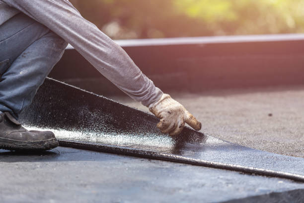 Professional Basement Waterproofing technician working in Hilton, NY